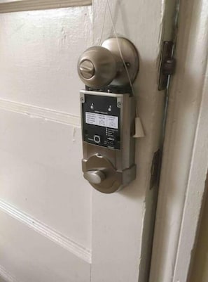Door lock from inside the house. To lock it turn the knob you see on the lock.