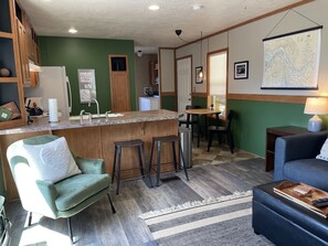Nice, open floor plan, with ceiling fan and AC unit for warmer weather. 