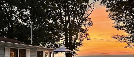 Enjoy the sunrise from the patio, screened in porch or from the private dock