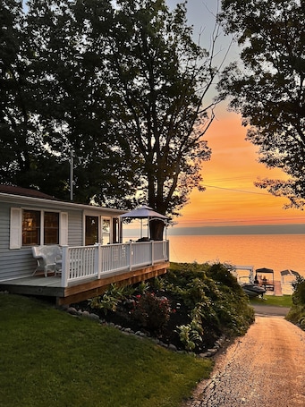 Enjoy the sunrise from the patio, screened in porch or from the private dock