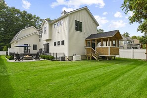 Backyard with covered porch and patio