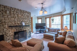 Cozy family room with stone fireplace