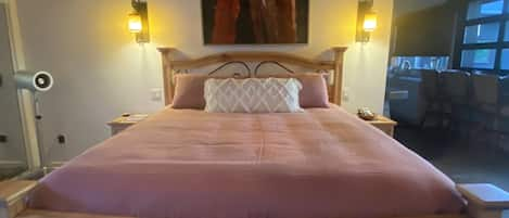 Mexican mansion bed.  Handmade linens. David Barnes artwork from Mendocino, CA.