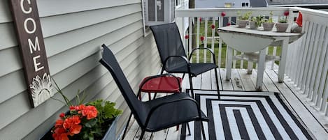 South facing deck that greets you upon arrival.  Fresh grown herbs to enjoy!