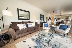 Open living room with lake views and electric fireplace