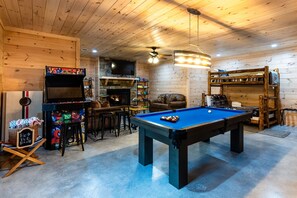Our basement game room has a pool table, Smart TV, and 4-player arcade with over 4,000 games.