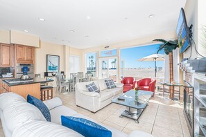 Patio doors from the main living area open up to let in those lovely ocean breezes.
                