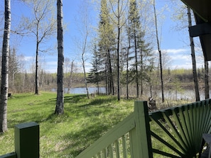 Covered front porch overlooks the West Bay of Long Lake