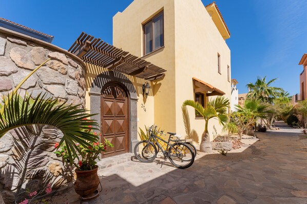 Main entrance opens to private pool courtyard. Two Bikes available for guest use.