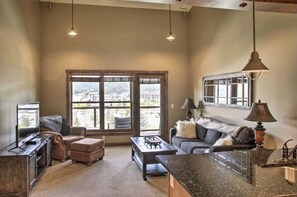 Living room with Queen size pull-out couch.