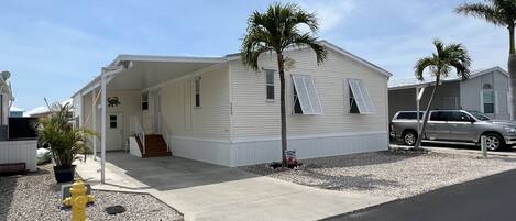 Carport with room to park a 2nd vehicle or small boat trailer in front