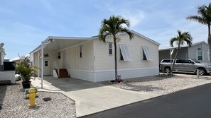 Carport with room to park a 2nd vehicle or small boat trailer in front