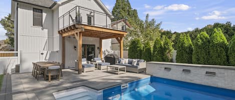 Backyard patio with heated pool