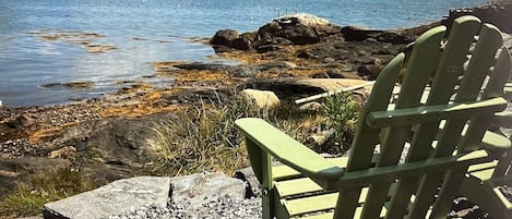 Adirondack chairs overlook the private rocky cove, explore the tidepools!