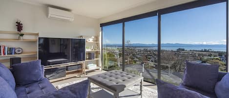 Sunny living area with stunning views over Tasman Bay!