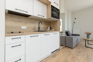 Cook and dine in style with the modern kitchenette and dining area.