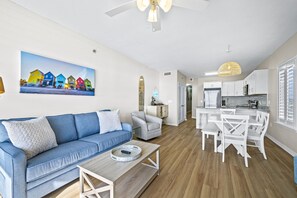 Living room with sleeper sofa, balcony access & wonderful view.