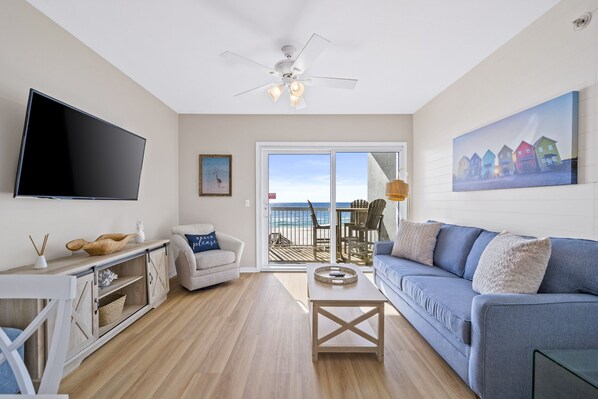 Living room with sleeper sofa, balcony access & wonderful view.