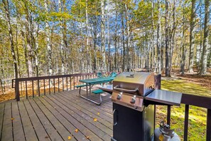 Spacious deck featuring a picnic table and BBQ grill, perfect for outdoor meals and gatherings. Enjoy fresh air while savoring delicious meals with family and friends!  | Serhii Vacation Rentals