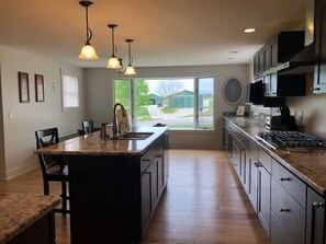 Newly Remodeled and Modern Kitchen - Newly Remodeled and Modern Kitchen with gas range, stainless steel appliances and bar seating