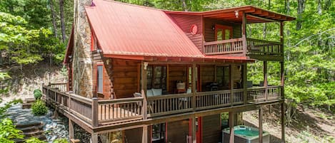 Exterior view shows each level and the homes private hot tub