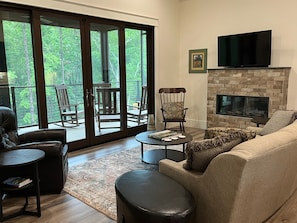 Living area.  Notice screen porch with 12' sliders. 