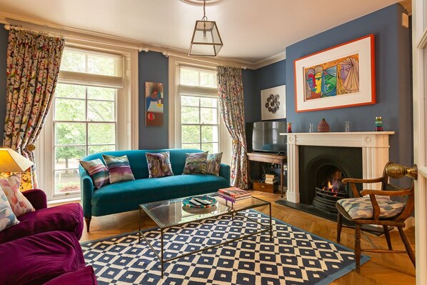 Elegant sitting room with underfloor heating, and views across garden square 