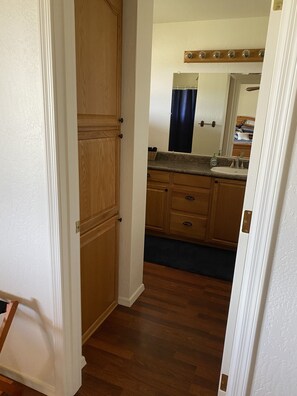 Full bath (shower only) connected to queen bedroom one.