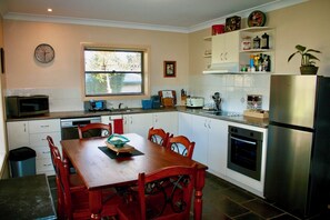 Fully Contained Kitchen with Dishwasher and Dining Table
