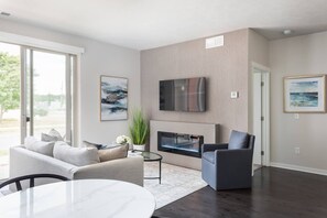Unwind after exploring around town by the cozy fireplace, enjoying your favorite movie on the large-screen Smart TV.