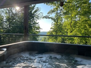 Sunrise in the hot tub overlooking beautiful scenery. Our hot tub is hot year-round!