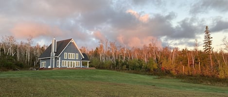 Looking at the cottage from the waterfront edge.