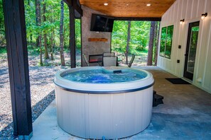 Unwind in the hot tub and catch up on your latest binge-worthy show or keep an eye out for deer wandering among the trees