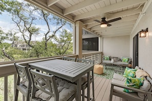 Large porch has space for dining and relaxing