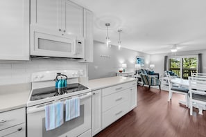 Custom cabinets, subway tile backsplash and quartz countertops
