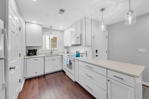 The renovated kitchen is open to the main living space of this villa