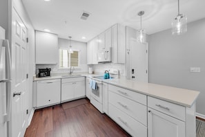 The renovated kitchen is open to the main living space of this villa