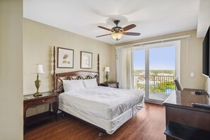 Lakefront Primary Bedroom with King Size Bed, Flat Screen TV, Ensuite Bathroom, and Privately Furnished Balcony Access