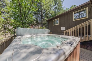 Unwind in the private hot tub surrounded by nature.