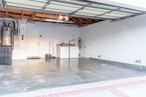 Park, charge, store, or do laundry in this attached 2-car garage designed for maximum flexibility and convenience!