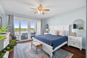 Primary Bedroom with Lake and Light Show Views, King Size Bed, Flat Screen TV, Ensuite Balcony and Private Balcony Access