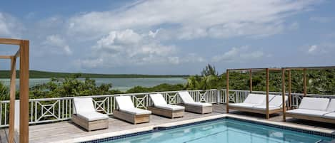 Welcome to Pointe House on Savannah Sound, a newly remodeled luxury home with a private pool and a private boat dock, a short walk from Windermere's famous miles-long pink-sand beach.