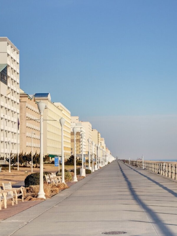 Virginia Beach boardwalk goes for mile: catch the Navy Memorial, Neptune statue, and endless bars, restaurants, and sweet shops on this strip.