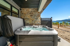 Enjoy amazing lake views right from the walkout in your private hot tub.