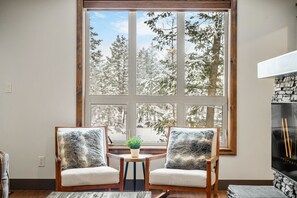 Living room with a smart TV & a gas-lit fireplace