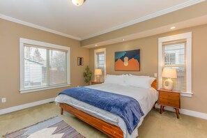 Master bedroom with King Bed, walk-in closet, and dresser