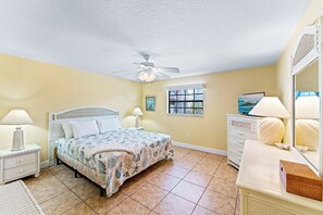 Drift into restful sleep in this serene master bedroom, where the king-sized bed invites you to relax after a day in the sun.