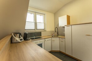 Ferienwohnung mit 1 Schlafzimmer und Grillmöglichkeit-Küche