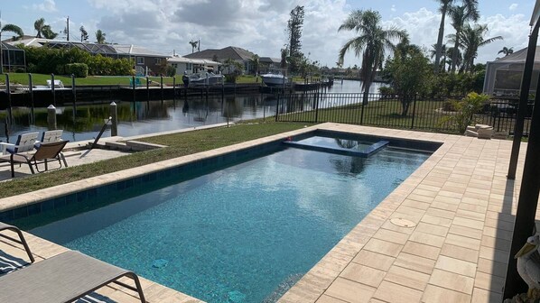 Pool with spa overlooks the canal