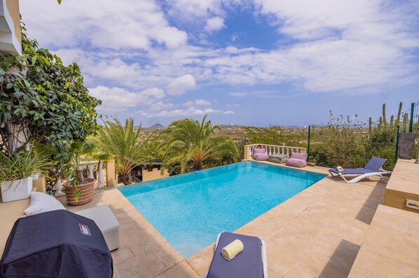 Escape to paradise and indulge in the luxury of our private pool area with infinity pool, sun longes and parasols.